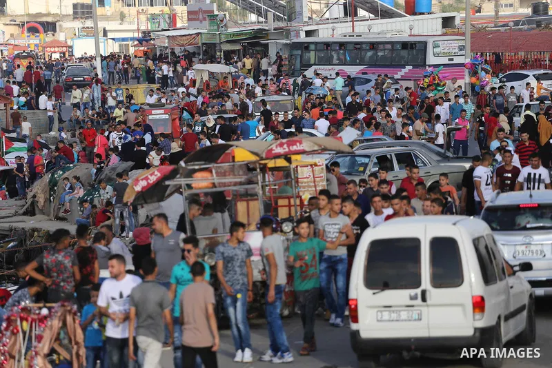 Palestinians celebrate on the second day of Eid al-Fitr holiday which marks the end of the Muslim holy month of Ramadan at the seaport of Gaza city June 26, 2017. Photo by Mohammed Asad
