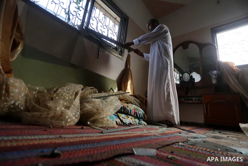 A Palestinian man inspects his home following an Israeli air strike in Gaza City on June 27, 2017. Israeli airstrikes hit a series of targets in the Hamas-run Gaza Strip overnight June 26, officials said, hours after a r...