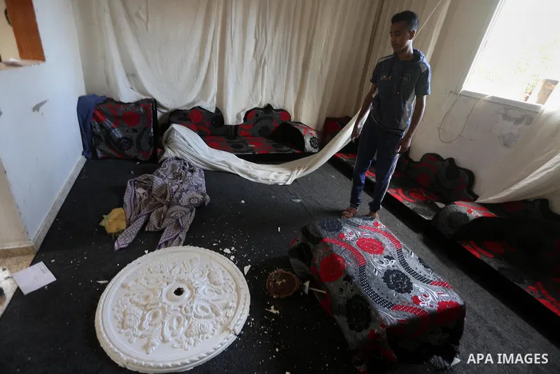 A Palestinian man inspects his home following an Israeli air strike in Gaza City on June 27, 2017. Israeli airstrikes hit a series of targets in the Hamas-run Gaza Strip overnight June 26, officials said, hours after a r...