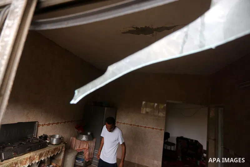 A Palestinian man inspects his home following an Israeli air strike in Gaza City on June 27, 2017. Israeli airstrikes hit a series of targets in the Hamas-run Gaza Strip overnight June 26, officials said, hours after a r...