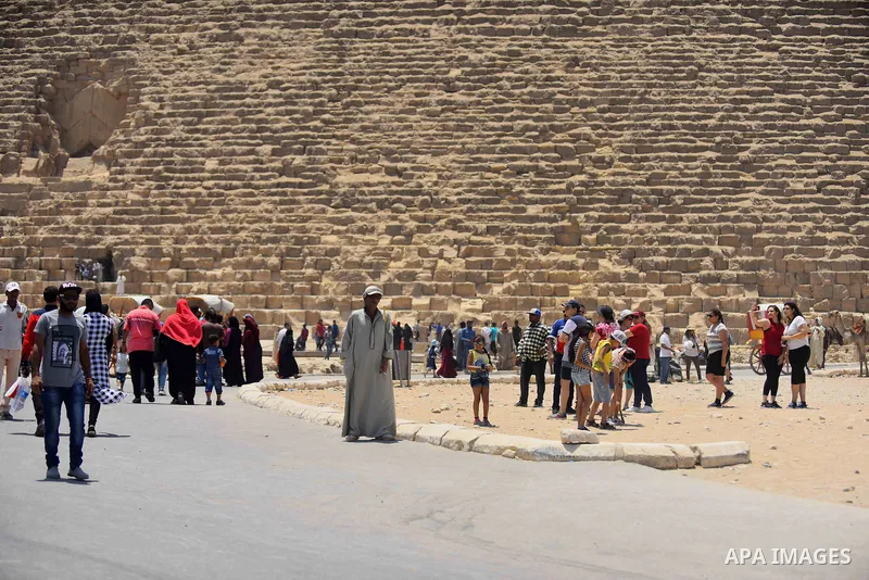 Egyptians celebrate on the third day of Eid al-Fitr holiday at Giza pyramids, which marks the end of the Muslim holy month of Ramadan, in Cairo June 27, 2017. Photo by Amr Sayed