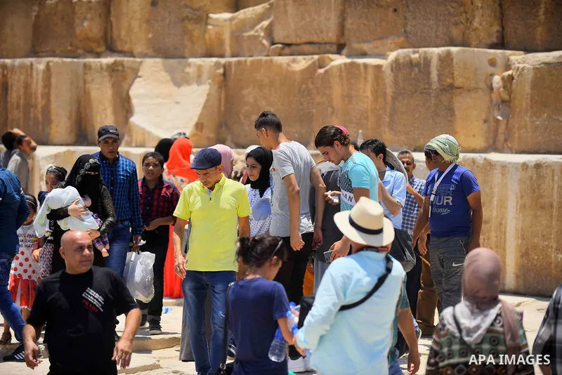 Egyptians celebrate on the third day of Eid al-Fitr holiday at Giza pyramids, which marks the end of the Muslim holy month of Ramadan, in Cairo June 27, 2017. Photo by Amr Sayed