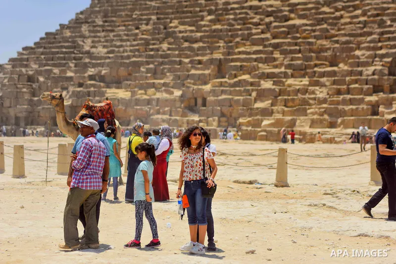 Egyptians celebrate on the third day of Eid al-Fitr holiday at Giza pyramids, which marks the end of the Muslim holy month of Ramadan, in Cairo June 27, 2017. Photo by Amr Sayed