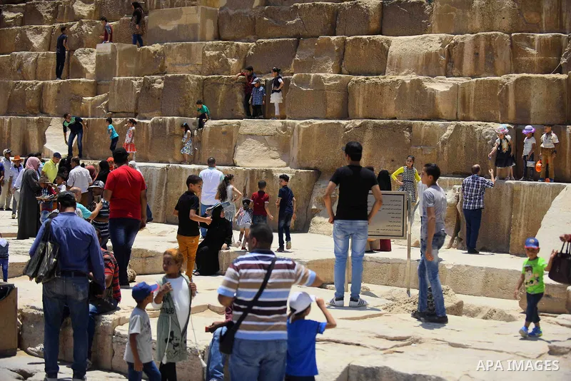 Egyptians celebrate on the third day of Eid al-Fitr holiday at Giza pyramids, which marks the end of the Muslim holy month of Ramadan, in Cairo June 27, 2017. Photo by Amr Sayed