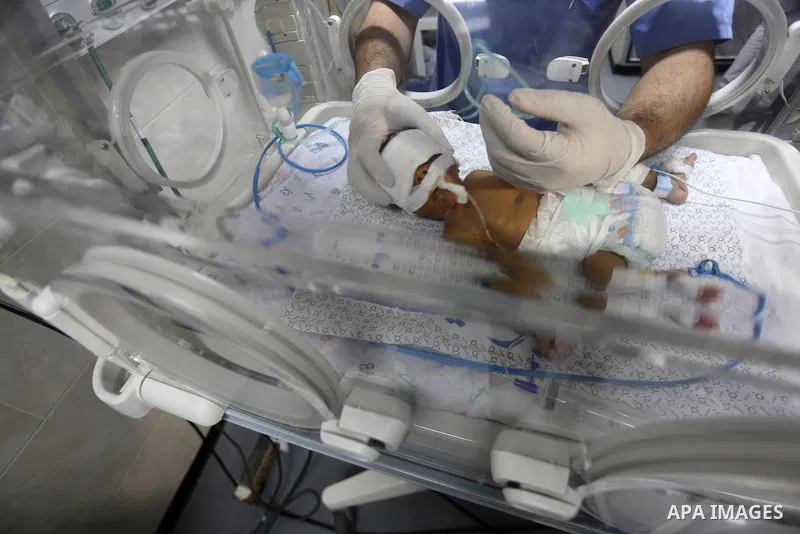 A newborn is seen inside an incubator at the neonatal intensive care unit at Shifa hospital in Gaza city on June 27, 2017. Hamas accused the Palestinian Authority and Israel of refusing to grant documents to Gazans in ne...
