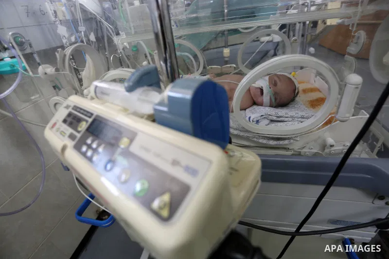 A newborn is seen inside an incubator at the neonatal intensive care unit at Shifa hospital in Gaza city on June 27, 2017. Hamas accused the Palestinian Authority and Israel of refusing to grant documents to Gazans in ne...