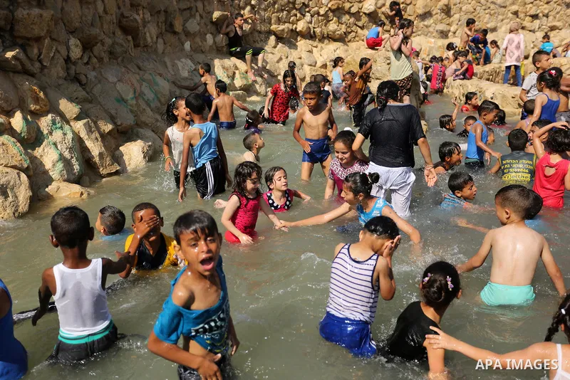 Palestinian children swim in a pool at an amusement park on the third day of Eid al-Fitr holiday which marks the end of the Muslim holy month of Ramadan, in Gaza City on June 27, 2017. Photo by Ashraf Amra