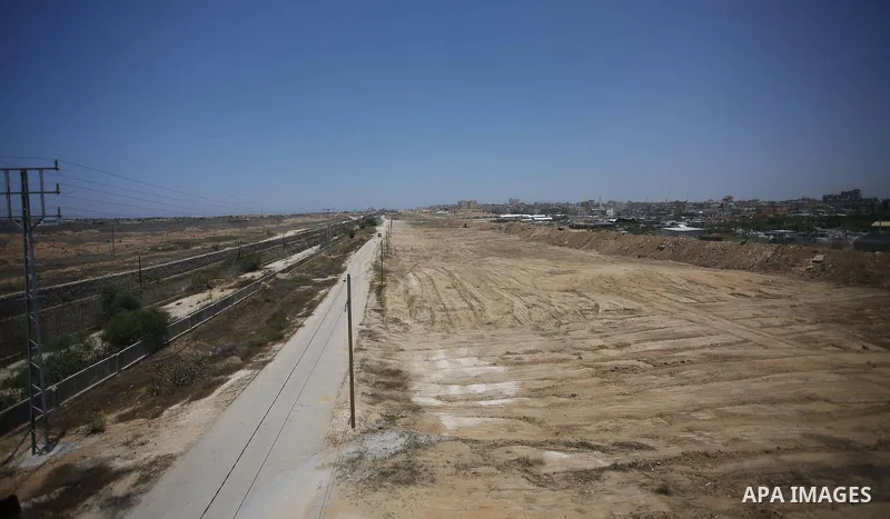 Palestinian bulldozers clear an area as Hamas begins creating a large buffer zone on the border with Egypt in the southern Gaza strip town of Rafah, on June 28, 2017. The buffer zone is expected to extend for a length of...