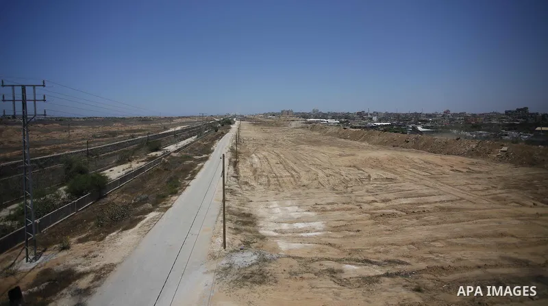 Palestinian bulldozers clear an area as Hamas begins creating a large buffer zone on the border with Egypt in the southern Gaza strip town of Rafah, on June 28, 2017. The buffer zone is expected to extend for a length of...
