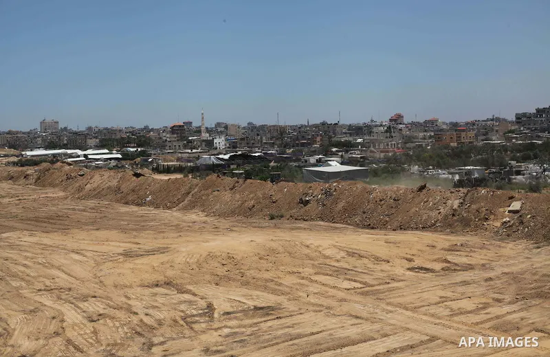 Palestinian bulldozers clear an area as Hamas begins creating a large buffer zone on the border with Egypt in the southern Gaza strip town of Rafah, on June 28, 2017. The buffer zone is expected to extend for a length of...
