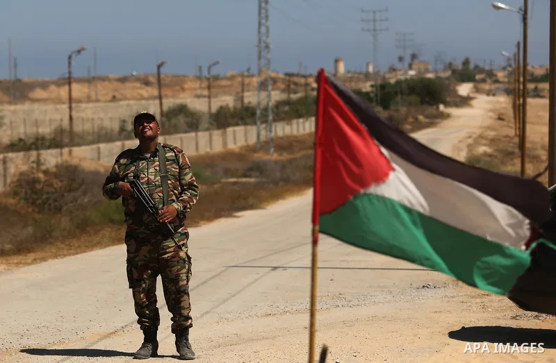 A member of Palestinian security forces stands guard during patrol a section of the border with Egypt, in the southern Gaza strip town of Rafah, on June 29, 2017. The buffer zone is expected to extend for a length of 12...