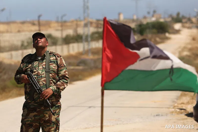 A member of Palestinian security forces stands guard during patrol a section of the border with Egypt, in the southern Gaza strip town of Rafah, on June 29, 2017. The buffer zone is expected to extend for a length of 12...