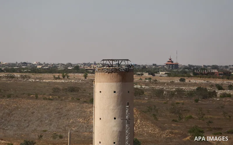 Parliment Palestinian bulldozers clear an area as Hamas begins creating a large buffer zone on the border with Egypt in the southern Gaza strip town of Rafah, on June 29, 2017. The buffer zone is expected to extend for a...