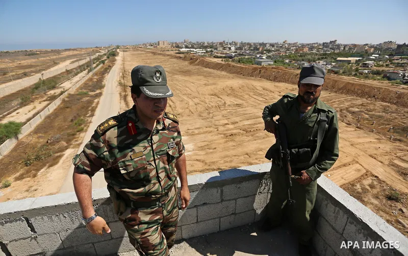 Members of Palestinian security forces patrol a section of the border with Egypt, in the southern Gaza strip town of Rafah, on June 29, 2017. The buffer zone is expected to extend for a length of 12 kilometres and at a w...
