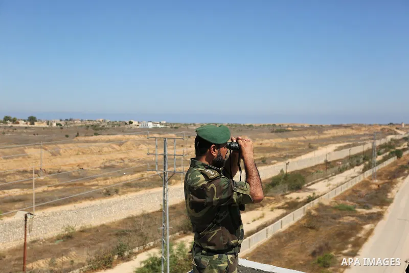 A member of Palestinian security forces stands guard during patrol a section of the border with Egypt, in the southern Gaza strip town of Rafah, on June 29, 2017. The buffer zone is expected to extend for a length of 12...