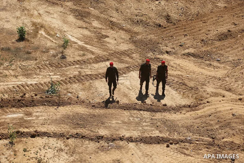 Members of Palestinian security forces patrol a section of the border with Egypt, in the southern Gaza strip town of Rafah, on June 29, 2017. The buffer zone is expected to extend for a length of 12 kilometres and at a w...