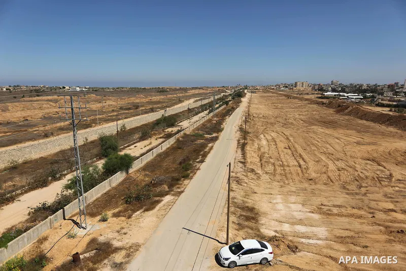 Parliment Palestinian bulldozers clear an area as Hamas begins creating a large buffer zone on the border with Egypt in the southern Gaza strip town of Rafah, on June 29, 2017. The buffer zone is expected to extend for a...