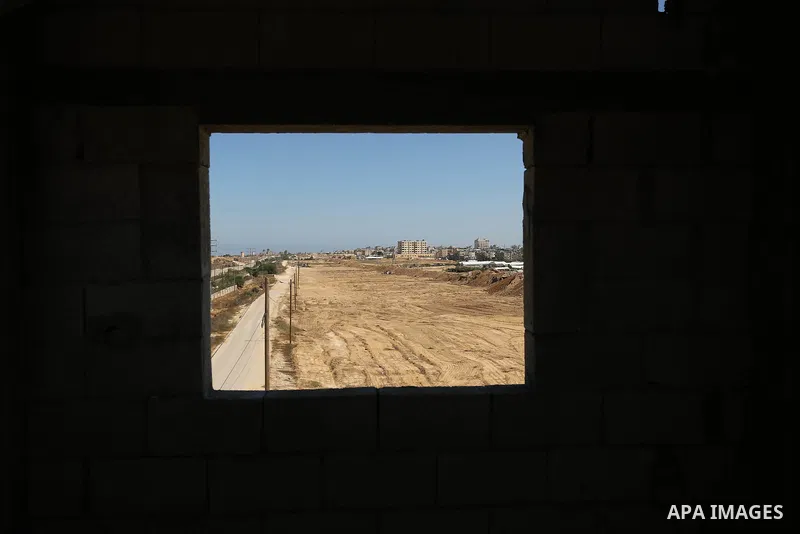 Parliment Palestinian bulldozers clear an area as Hamas begins creating a large buffer zone on the border with Egypt in the southern Gaza strip town of Rafah, on June 29, 2017. The buffer zone is expected to extend for a...