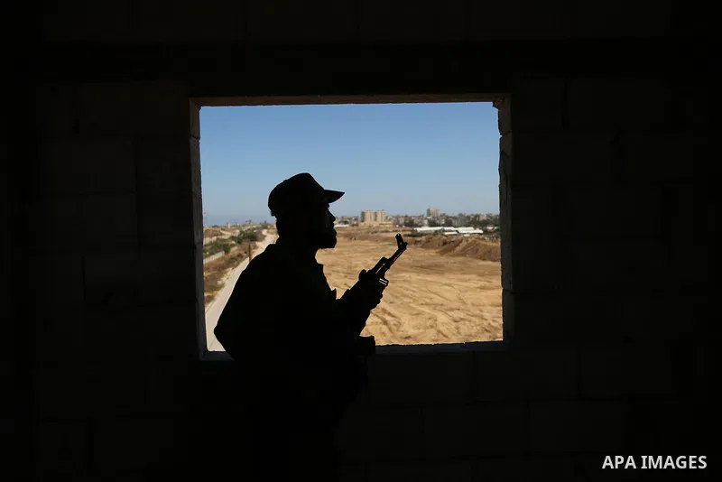 A member of Palestinian security forces stands guard during patrol a section of the border with Egypt, in the southern Gaza strip town of Rafah, on June 29, 2017. The buffer zone is expected to extend for a length of 12...