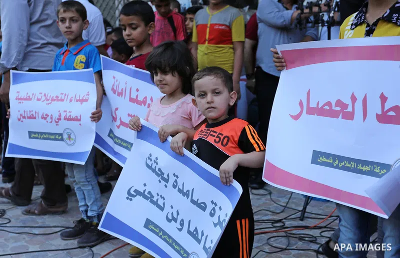 Palestinians take part in a protest against Israeli blockade and demanding to travel for treatment, in Gaza city on June 29, 2017. Hamas accused the Palestinian Authority and Israel of refusing to grant documents to Gaza...