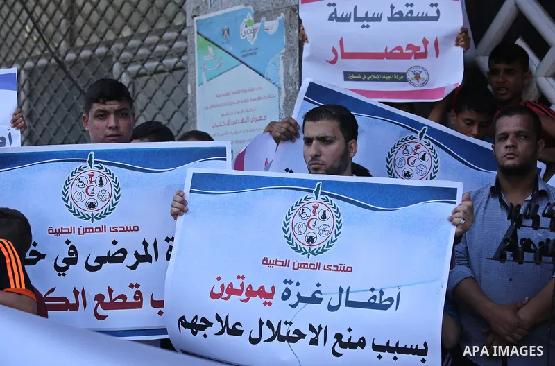 Palestinians take part in a protest against Israeli blockade and demanding to travel for treatment, in Gaza city on June 29, 2017. Hamas accused the Palestinian Authority and Israel of refusing to grant documents to Gaza...