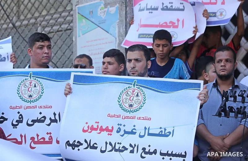 Palestinians take part in a protest against Israeli blockade and demanding to travel for treatment, in Gaza city on June 29, 2017. Hamas accused the Palestinian Authority and Israel of refusing to grant documents to Gaza...