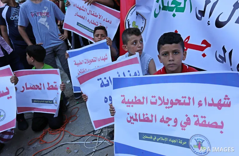 Palestinians take part in a protest against Israeli blockade and demanding to travel for treatment, in Gaza city on June 29, 2017. Hamas accused the Palestinian Authority and Israel of refusing to grant documents to Gaza...