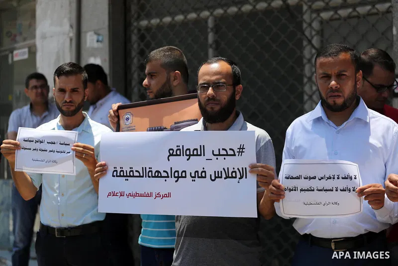 Palestinian journalists take part in a protest against the decision of Palestinian Authority's public prosecutor to block 11 Palestinian news websites in the Israeli-occupied West Bank, in Gaza city on July 01, 2017. Pho...