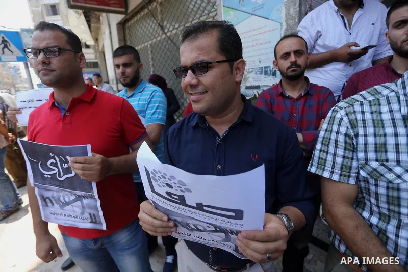Palestinian journalists take part in a protest against the decision of Palestinian Authority's public prosecutor to block 11 Palestinian news websites in the Israeli-occupied West Bank, in Gaza city on July 01, 2017. Pho...