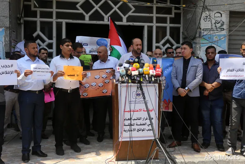 Palestinian journalists take part in a protest against the decision of Palestinian Authority's public prosecutor to block 11 Palestinian news websites in the Israeli-occupied West Bank, in Gaza city on July 01, 2017. Pho...