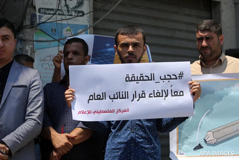 Palestinian journalists take part in a protest against the decision of Palestinian Authority's public prosecutor to block 11 Palestinian news websites in the Israeli-occupied West Bank, in Gaza city on July 01, 2017. Pho...