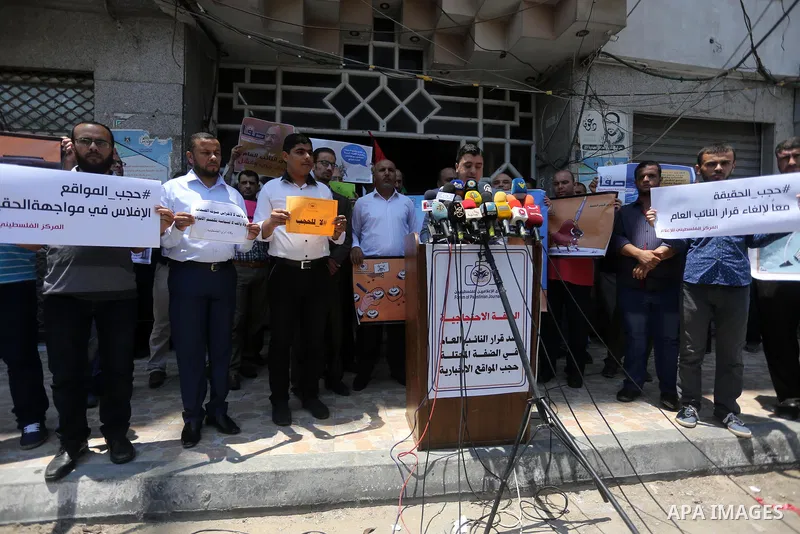 Palestinian journalists take part in a protest against the decision of Palestinian Authority's public prosecutor to block 11 Palestinian news websites in the Israeli-occupied West Bank, in Gaza city on July 01, 2017. Pho...