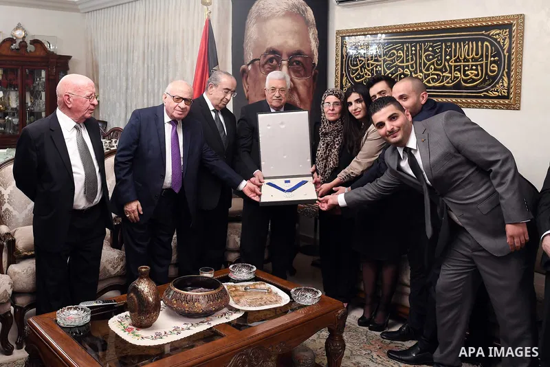 Palestinian President Mahmoud Abbas gives the Ambassador Daleel Mikhail Al-Qusous, the Medal of Merit and Excellence, in Amman on July 1, 2017. Photo by Thaer Ganaim