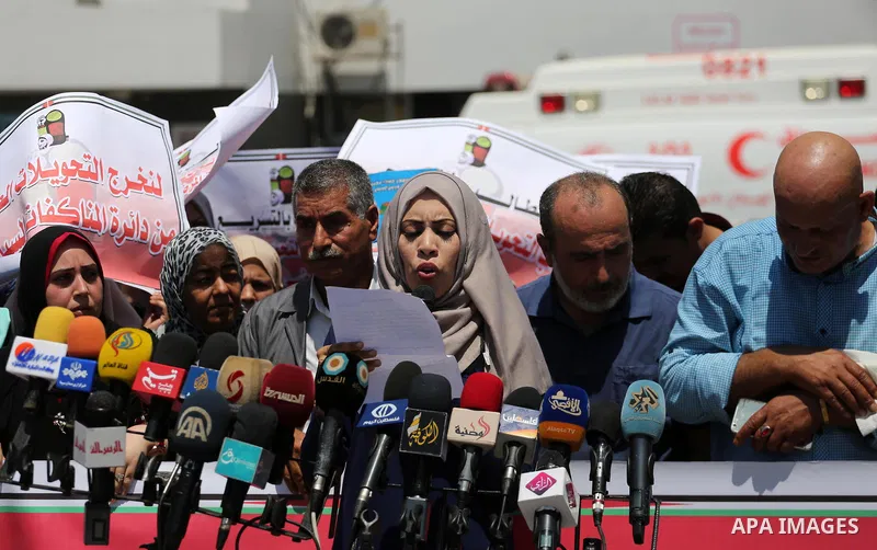 Palestinians take part in a protest demanding to travel for treatment, in Gaza city on July 3, 2017. Hamas accused the Palestinian Authority and Israel of refusing to grant documents to Gazans in need of permission to se...