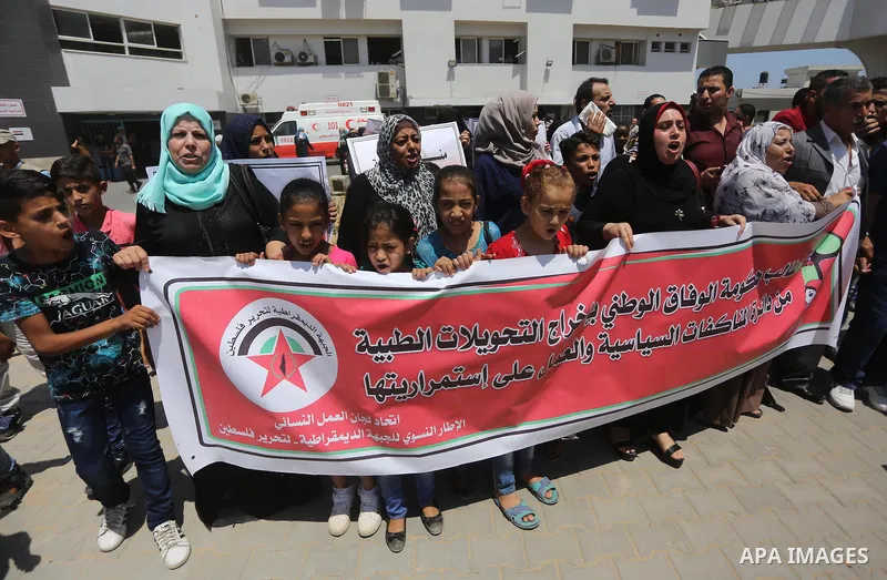Palestinians take part in a protest demanding to travel for treatment, in Gaza city on July 3, 2017. Hamas accused the Palestinian Authority and Israel of refusing to grant documents to Gazans in need of permission to se...