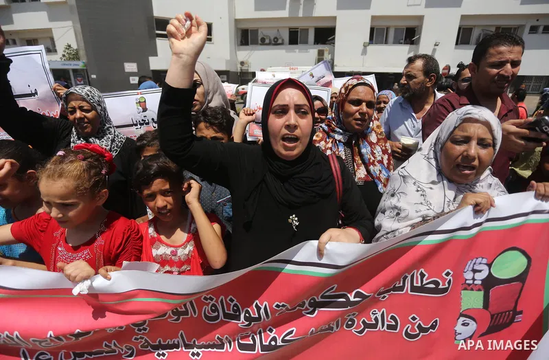 Palestinians take part in a protest demanding to travel for treatment, in Gaza city on July 3, 2017. Hamas accused the Palestinian Authority and Israel of refusing to grant documents to Gazans in need of permission to se...
