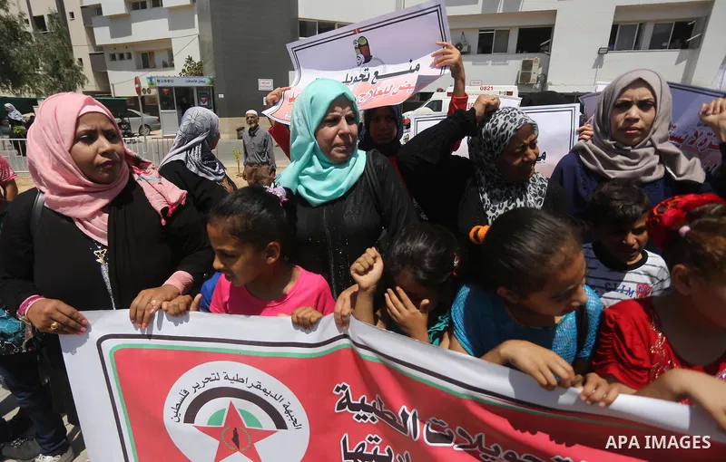 Palestinians take part in a protest demanding to travel for treatment, in Gaza city on July 3, 2017. Hamas accused the Palestinian Authority and Israel of refusing to grant documents to Gazans in need of permission to se...