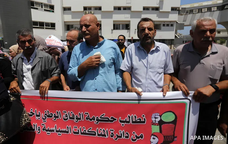 Palestinians take part in a protest demanding to travel for treatment, in Gaza city on July 3, 2017. Hamas accused the Palestinian Authority and Israel of refusing to grant documents to Gazans in need of permission to se...