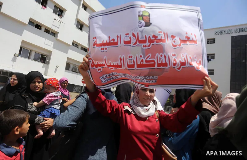 Palestinians take part in a protest demanding to travel for treatment, in Gaza city on July 3, 2017. Hamas accused the Palestinian Authority and Israel of refusing to grant documents to Gazans in need of permission to se...