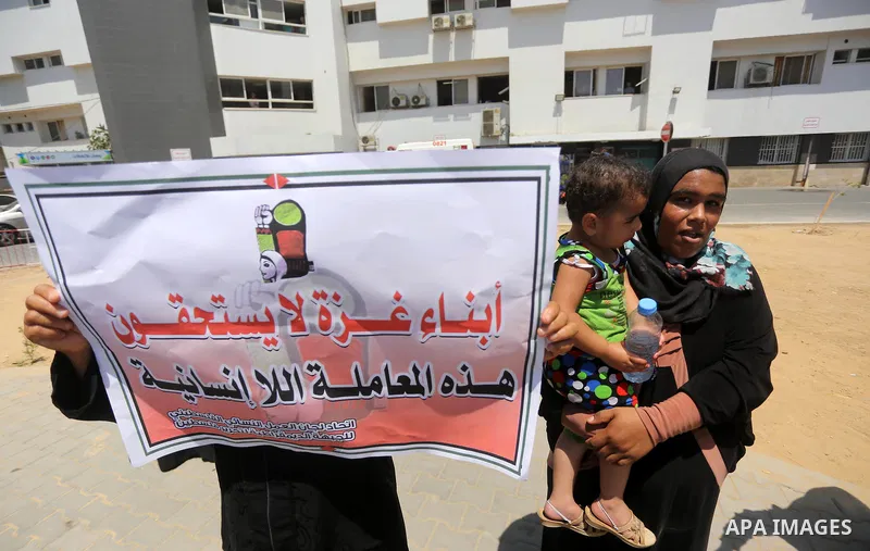 Palestinians take part in a protest demanding to travel for treatment, in Gaza city on July 3, 2017. Hamas accused the Palestinian Authority and Israel of refusing to grant documents to Gazans in need of permission to se...