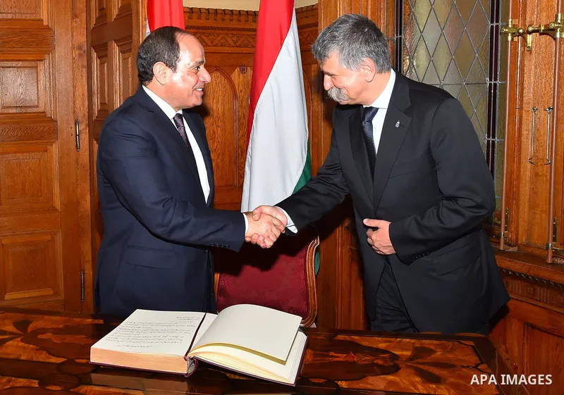 Egyptian President Abdel Fattah al-Sisi meets shakes hands with Speaker of the Hungarian Parliament Laszlo Kover in the Parliament building in Budapest, Hungary on July 3, 2017. Photo by Egyptian President Office