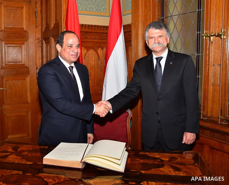 Egyptian President Abdel Fattah al-Sisi meets shakes hands with Speaker of the Hungarian Parliament Laszlo Kover in the Parliament building in Budapest, Hungary on July 3, 2017. Photo by Egyptian President Office