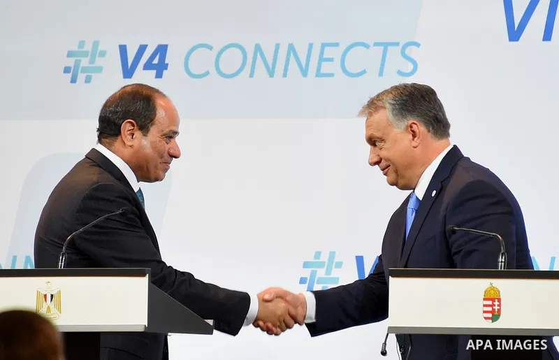 Egyptian President Abdel Fattah al-Sisi shakes hands with Hungarian Prime Minister Viktor Orban ahead of a joint press conference in Budapest on July 4, 2017 during a summit of the Visegrad group countries (V4) and Egypt...