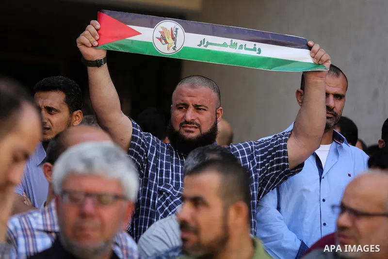 Palestinians take part in a protest demanding their salaries in Gaza city on July 5, 2017. Photo by Ashraf Amra