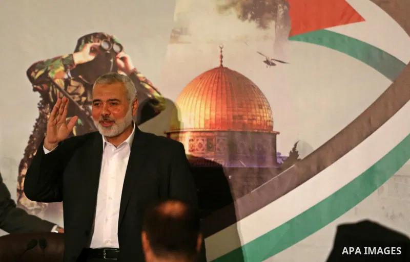 Hamas Chief Ismail Haniyeh waves before giving a speech in Gaza City on July 5, 2017. Haniya said that meetings between his movement and the Egyptian authorities would ease the siege imposed on the Gaza Strip for more th...