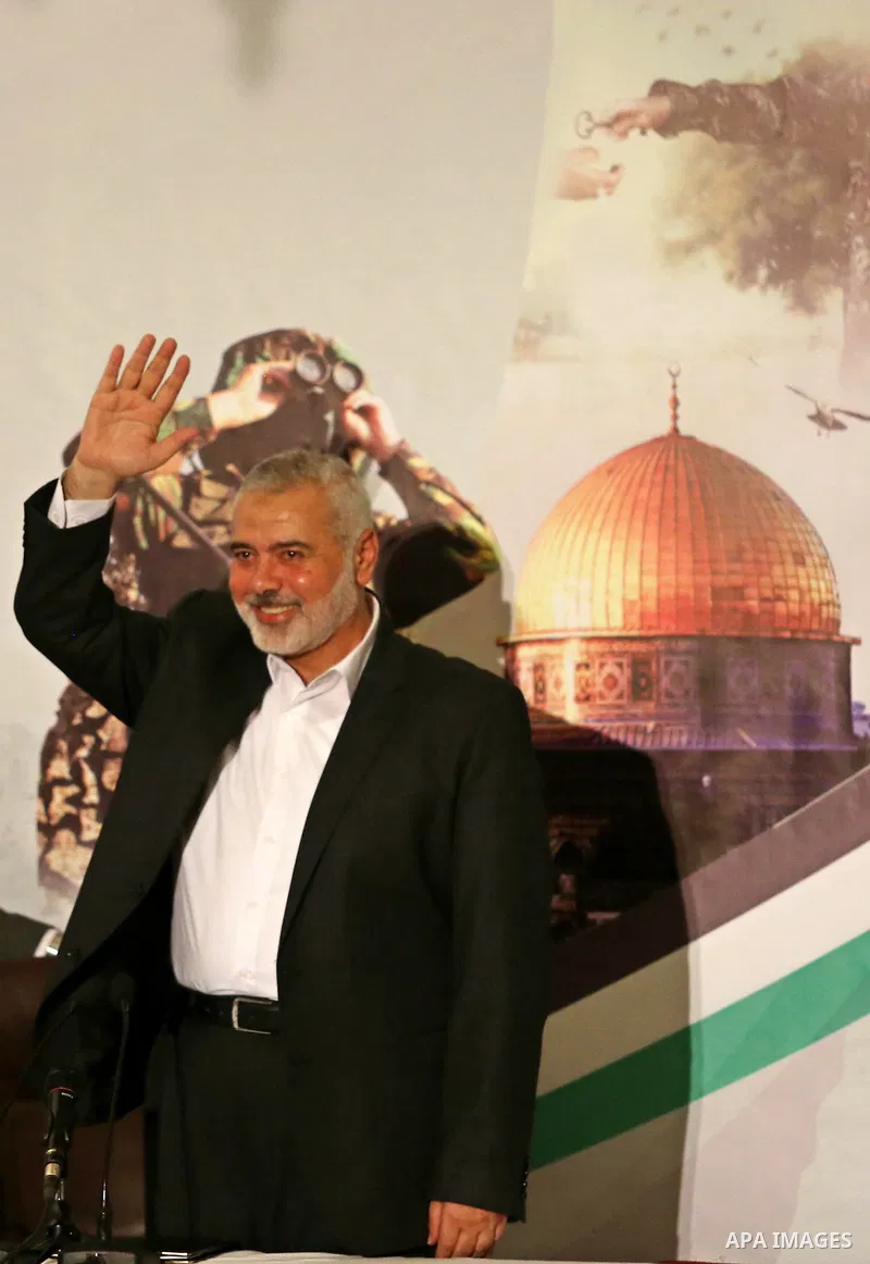 Hamas Chief Ismail Haniyeh waves before giving a speech in Gaza City on July 5, 2017. Haniya said that meetings between his movement and the Egyptian authorities would ease the siege imposed on the Gaza Strip for more th...