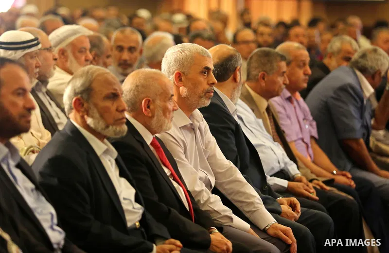 Yahya Sinwar the new leader of the Hamas Islamist movement in the Gaza Strip listens to a speech delivered by Hamas Chief Ismail Haniyeh in Gaza City on July 5, 2017. Haniya said that meetings between his movement and th...