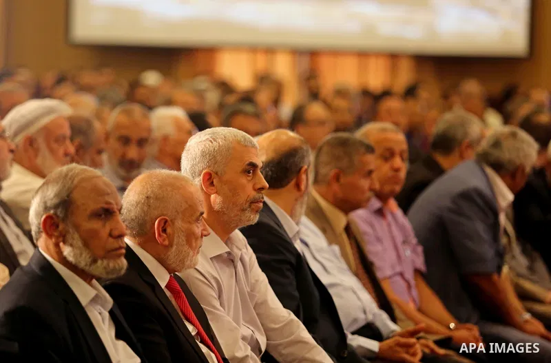 Yahya Sinwar the new leader of the Hamas Islamist movement in the Gaza Strip listens to a speech delivered by Hamas Chief Ismail Haniyeh in Gaza City on July 5, 2017. Haniya said that meetings between his movement and th...