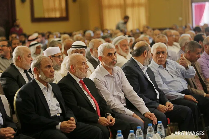 Yahya Sinwar the new leader of the Hamas Islamist movement in the Gaza Strip listens to a speech delivered by Hamas Chief Ismail Haniyeh in Gaza City on July 5, 2017. Haniya said that meetings between his movement and th...
