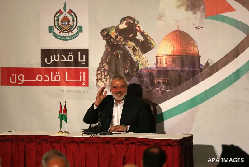Hamas Chief Ismail Haniyeh waves before giving a speech in Gaza City on July 5, 2017. Haniya said that meetings between his movement and the Egyptian authorities would ease the siege imposed on the Gaza Strip for more th...